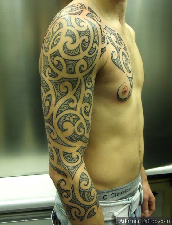 Maoristyle sleeve and chest tattoo side view 