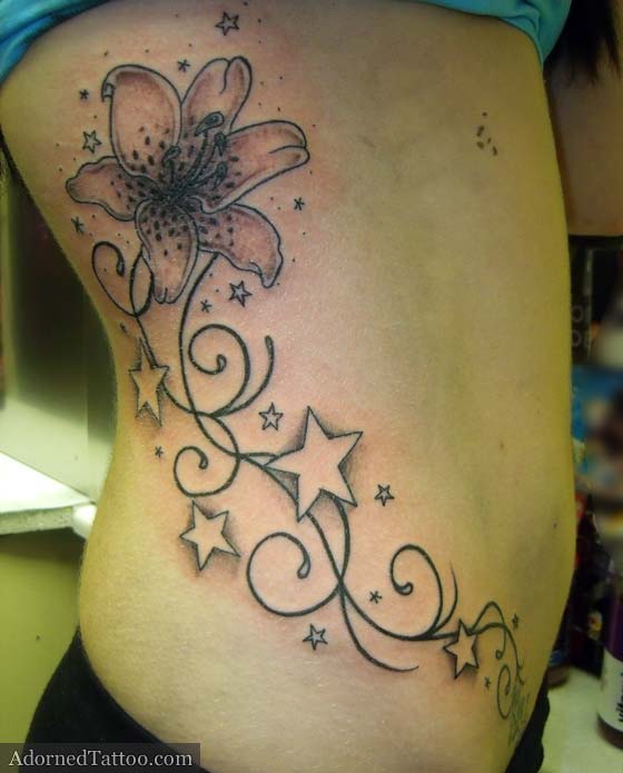 Lily, negative stars and swirly tribal tattoo