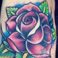Traditional rose tattoo on foot