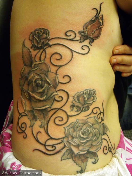 Roses and tribal rib cage tattoo. roses and tribal rib cage tattoo
