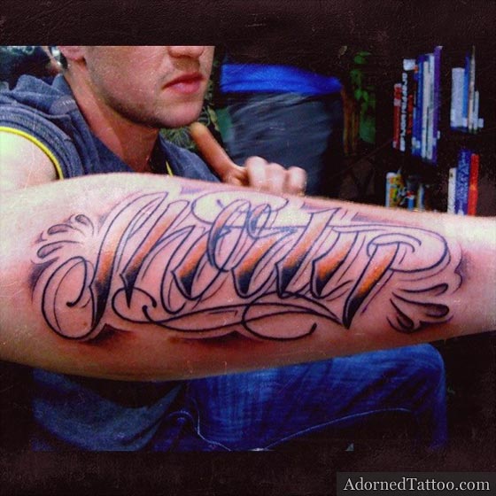 nickname script forearm tattoo