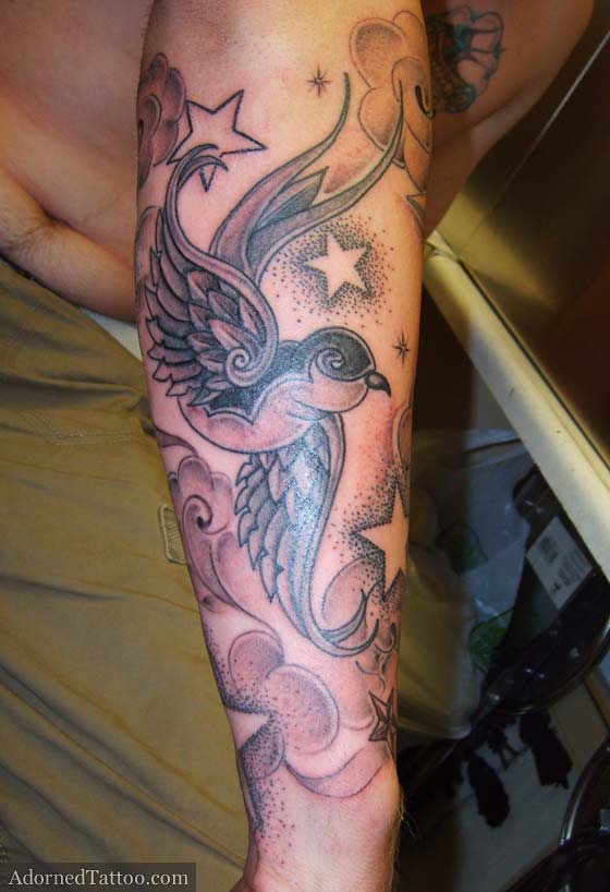Swallow tattoo with negative stars and clouds swallow forearm retro tattoo