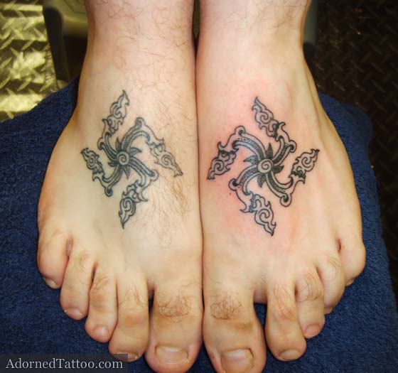 Joe wanted these two Thai-style swastika tattoos mirrored on his feet.