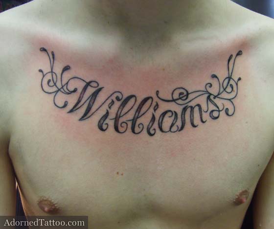 Surname and filigree chest tattoo. surname with filigree chest tattoo