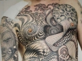 geometric dotwork chest tattoo by Alex