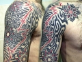geometric shoulder and sleeve tattoo by Alex