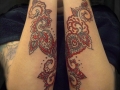 matching forearm tattoos by Alex