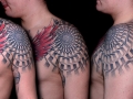 geometric dotwork shoulder tattoo by Alex